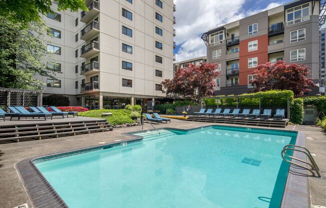 Downtown Portland OR Apartments for Rent - Linc 245 - Sparkling Pool Surrounded by Beautiful Landscaping and Comfy Lounge Seating