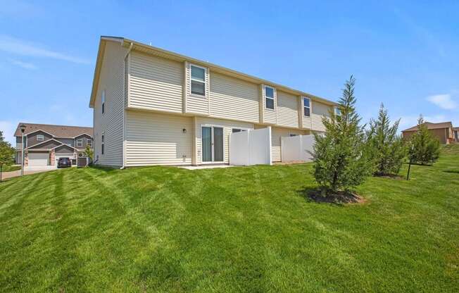 a house with a lawn in front of it