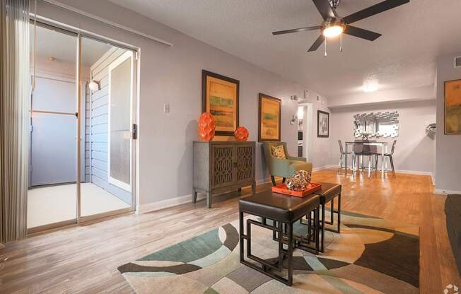A living room with a brown table and chairs.
