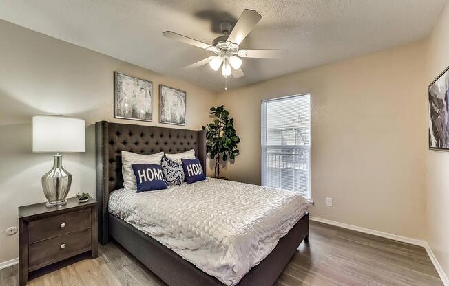 a bedroom with a bed in a room