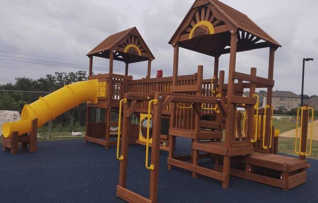 Playground with Slide - Fully Fenced In  at Overlook at Stone Oak Park Apartments, Texas