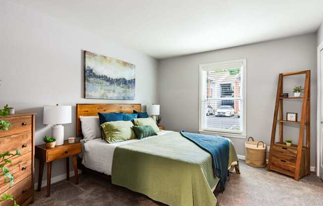 a bedroom with a bed and a window