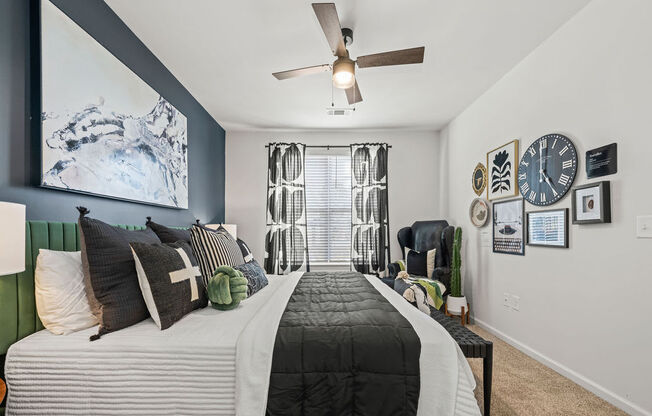 a bedroom with a bed and a ceiling fan