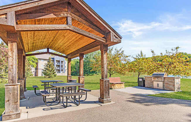 the pavilion at the reserve at city center boasts a picnic table and a grill