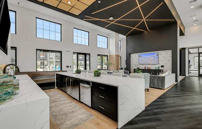 a kitchen with an island and a living room in the background at Prism at Diamond Ridge, Pennsylvania, 15108