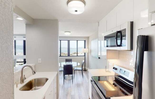 a kitchen and dining area in a 555 waverly unit