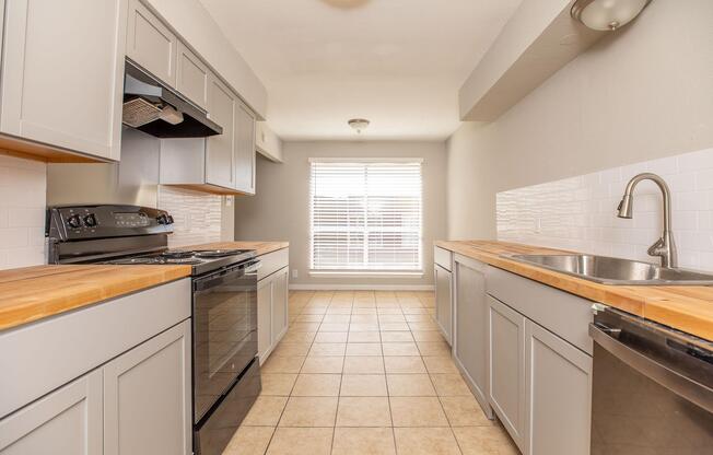a kitchen with a tile floor