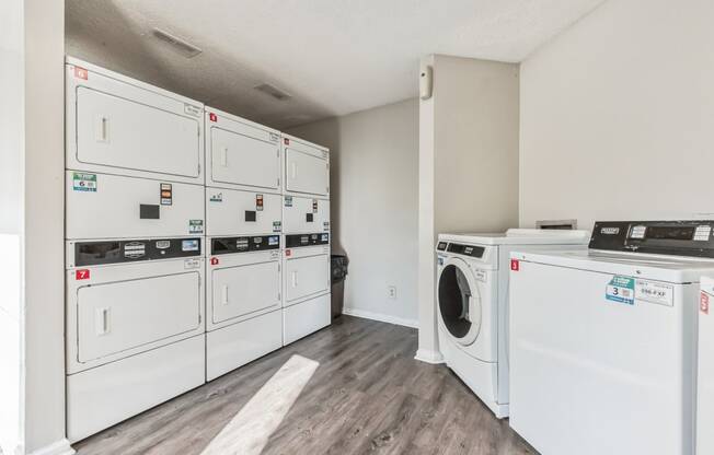 a washer and dryer in a laundry room with white appliances