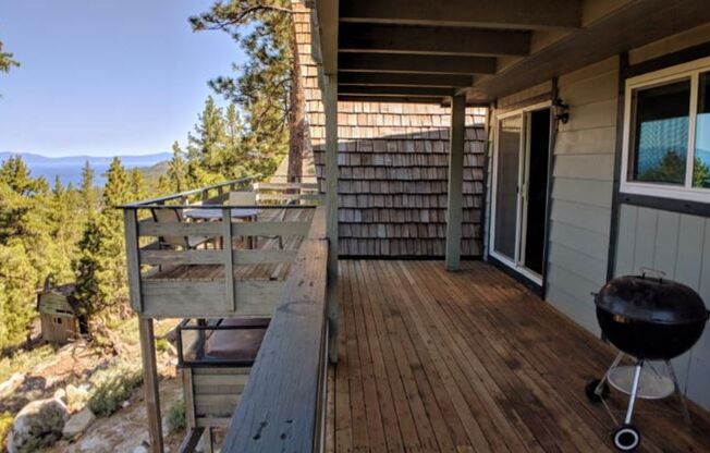 "Million Dollar Views" This home offers breath-taking views of majestic Lake Tahoe, a spacious home perched on the mountain side surrounded by large enchanted Pines; this is the home for you!