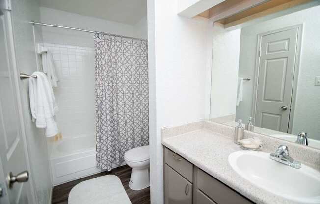 View of bathroom with full-size, vanity mirror.