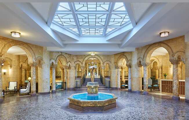 lobby with a fountain and a glass ceiling