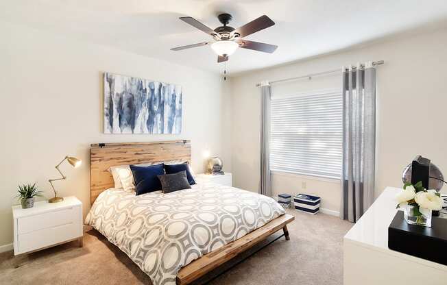 a bedroom with a bed and a ceiling fan at Landing Willow Bayou in Bossier City, LA