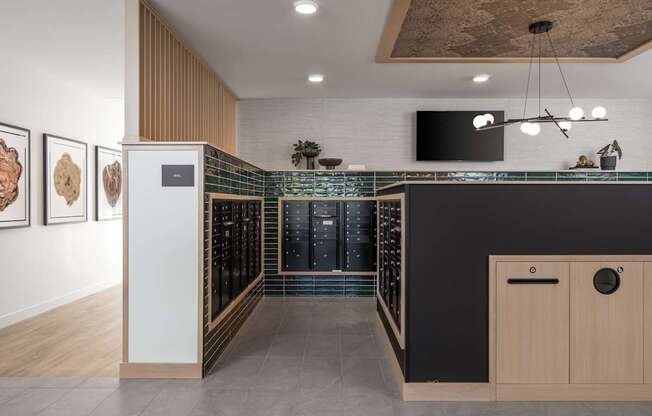 A modern kitchen with a black countertop and wooden cabinets.