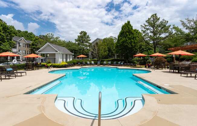 Tables and chairs by pool at Windsor Johns Creek, Johns Creek, GA