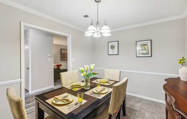 a dining room with a table and chairs