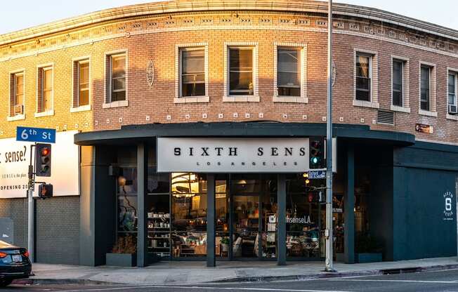 a brick building with a sign that reads 6th senses