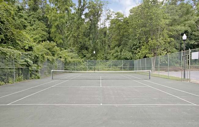 Tennis court at Painters Mill Apartments