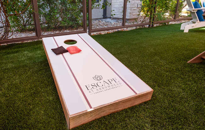 A wooden board with the word "ESCAPE" written on it.