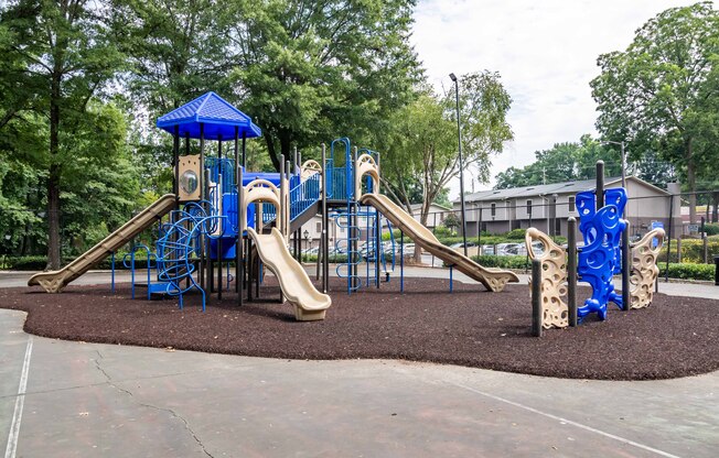 Colorful playground with slides and swings at Mirador at Idlewood Apartments near Stone Mountain and Kirkwood