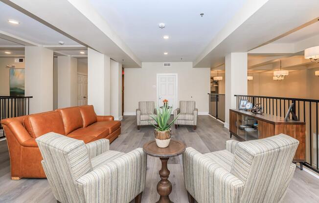 a living room filled with furniture and a flat screen tv