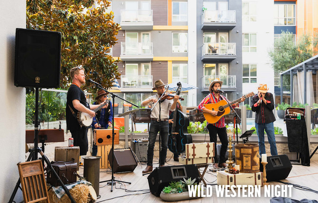 A group of people playing music on a stage with the words