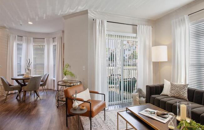 a living room with a couch and a table at Volare at the Woodlands, The Woodlands
