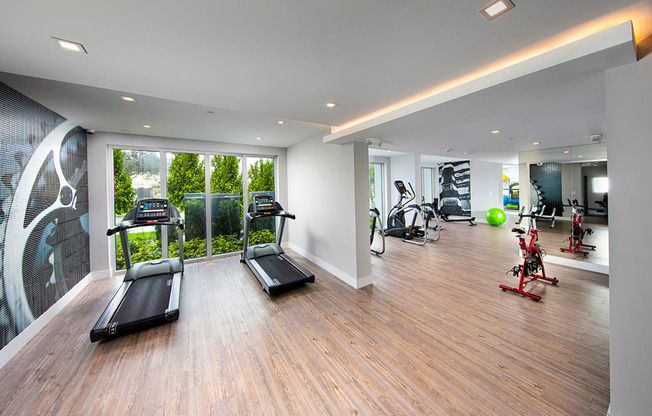 the gym has a view of the gymnasium and a floor to ceiling window at Saba Pompano Beach, Pompano Beach, 33062