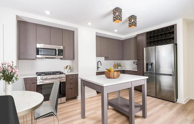 Discover your dream home at Modera Parkside! Our premium collection homes feature elegant under-cabinet kitchen lighting, distinctive fixtures, upgraded countertops, a stylish tile backsplash, and a captivating two-tone cabinet finish that elevates your living experience in Midtown Atlanta.