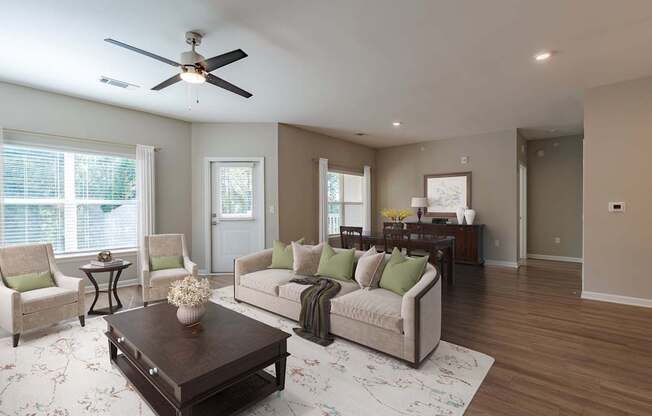 A living room with a brown coffee table and a beige sofa.
