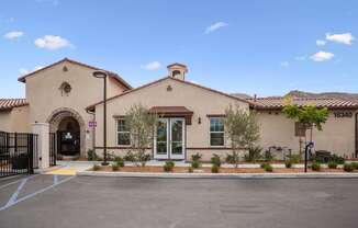 a building with a driveway and trees in front of it at Rancho Belago, Moreno Valley, CA, 92555