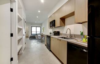 a kitchen and dining area in a 555 waverly unit