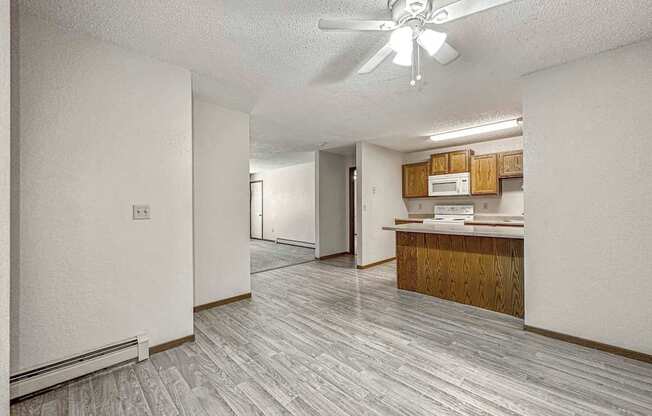 a view of a kitchen and living room with a geometric tile floor at Creekstone Falls, Sioux Falls, SD