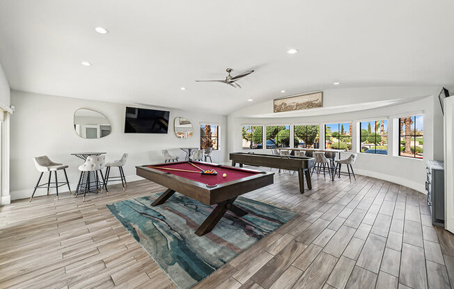 Community Clubhouse with Game Tables and Lounge Furniture at Stonegate Apartments located in Las Vegas, NV.