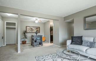 a living room with a couch and a glass coffee table