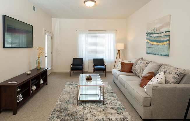 Classic Living Room Design With Television at Four Seasons at Southtowne Apartments, South Jordan, 84095