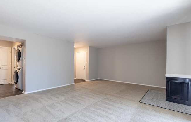 Spacious Living Room with a Fireplace in the Two Bedroom One Bath Apartment at Woodbridge Apartments Bloomington