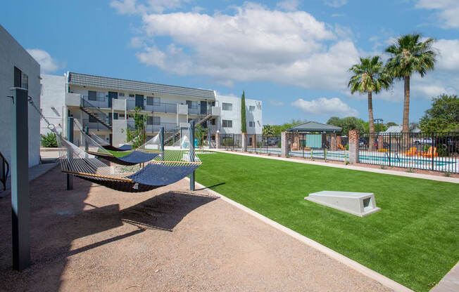 Hammock Lounge Area and Cornhole Playing Area at The Link at 4th Ave Apartments