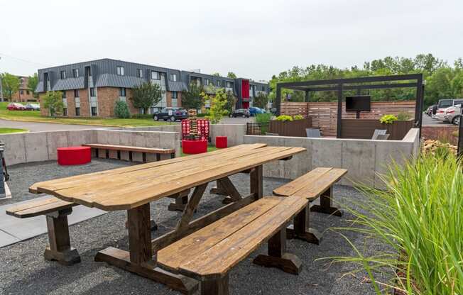 a picnic table in front of a building