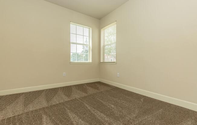 a bedroom with a large window