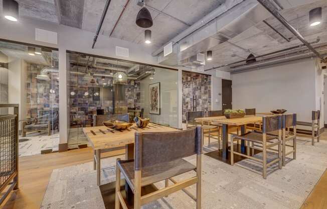 a dining room with wooden tables and chairs