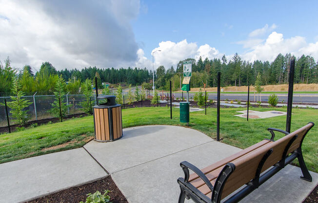 Park bench facing dog park