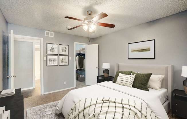 an open bedroom with a large bed and a ceiling fan