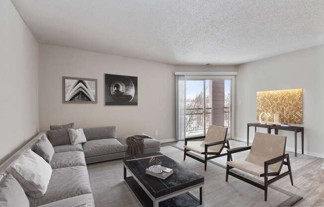 a living room with a couch and chairs and a table  at Eastwood Crossings, Missouri