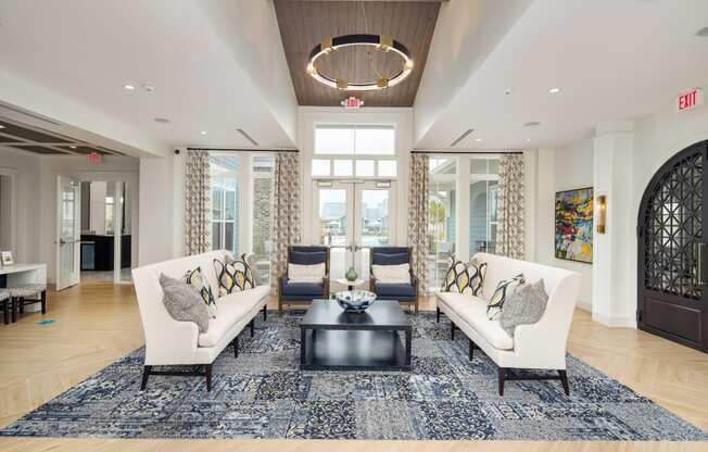 Interior of the leasing office and clubhouse with ample seating at The Highland in Augusta, GA
