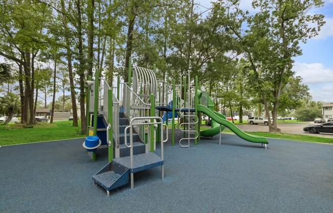 a playground with slides and monkey bars in a park