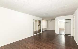 Living Room with Hardwood Floors and Mirrored Closet