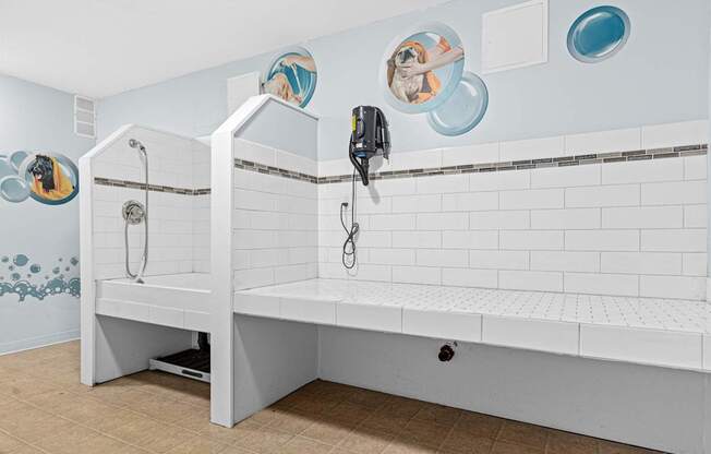 A white bathroom with a bench and a shower.