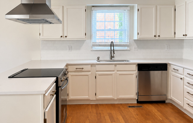 Charming 2 Bed Brick Home with Updated Kitchen, Hardwood Floors & Spacious Backyard