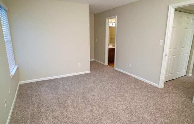 Carpeted Bedroom Hampton Center Apartments