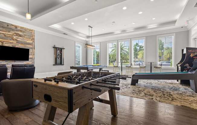 A modern kitchen with a wooden island and a fireplace.
